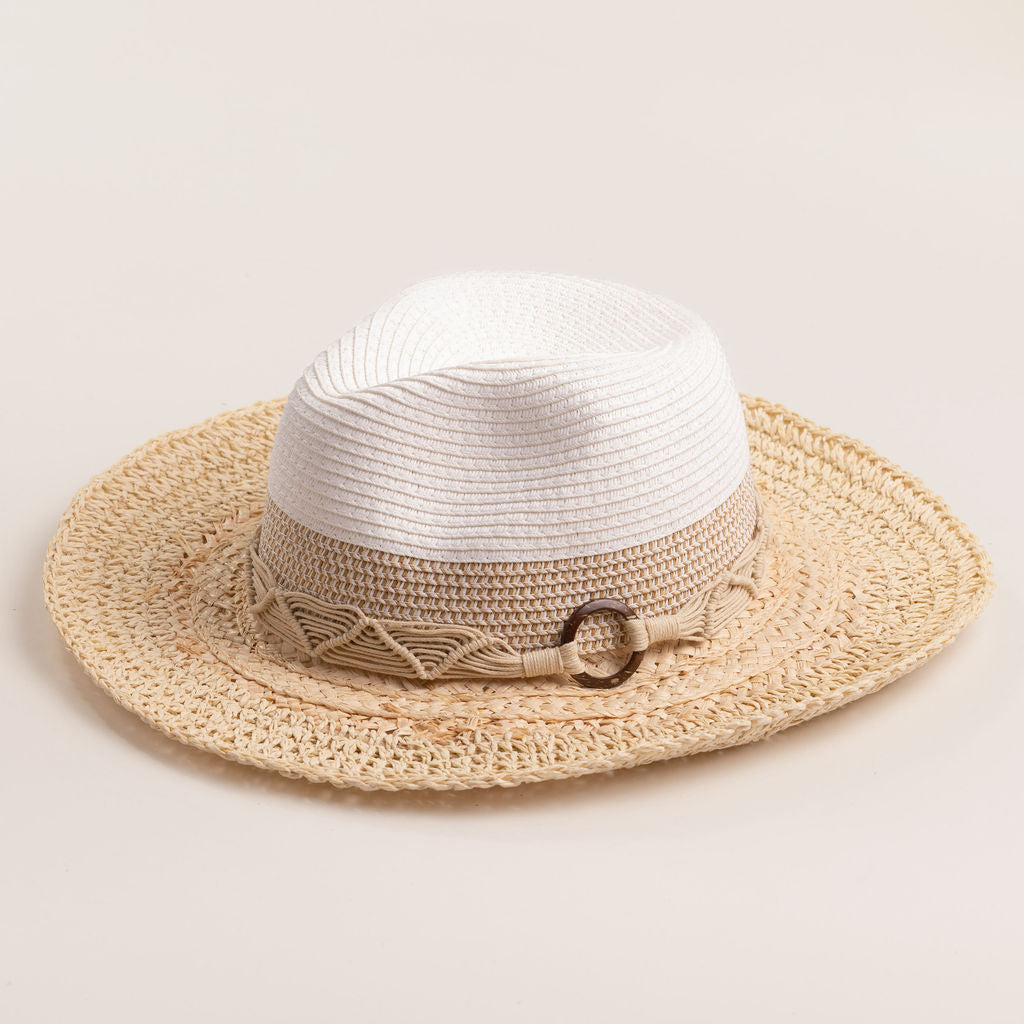 Two-toned straw hat with a beige brim and white top on a light beige background