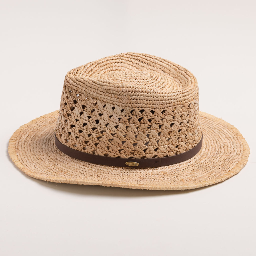 Natural colored straw hat with a brown band on a light gray background