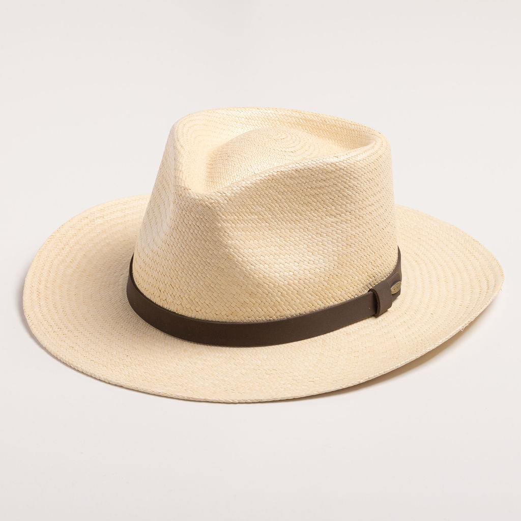 Natural colored Panama hat with a black band on a light gray background