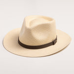 Natural colored Panama hat with a black band on a light gray background