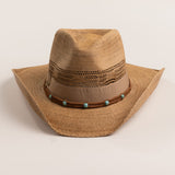 Tea colored straw-shaped cowboy hat with decorative band with turquoise beads on a light beige background
